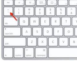 The backtick key, above Tab